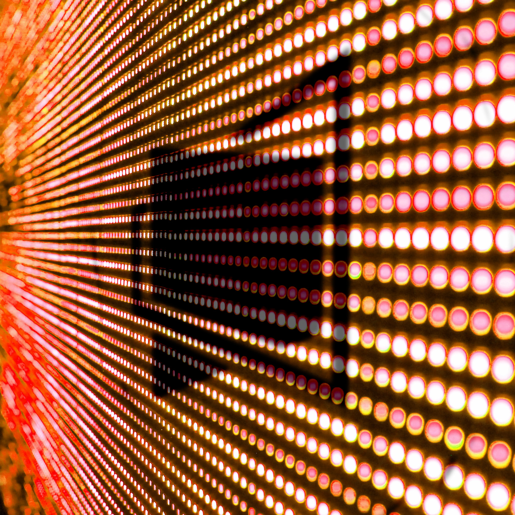 Close-up of a glowing LED dot-matrix display panel
