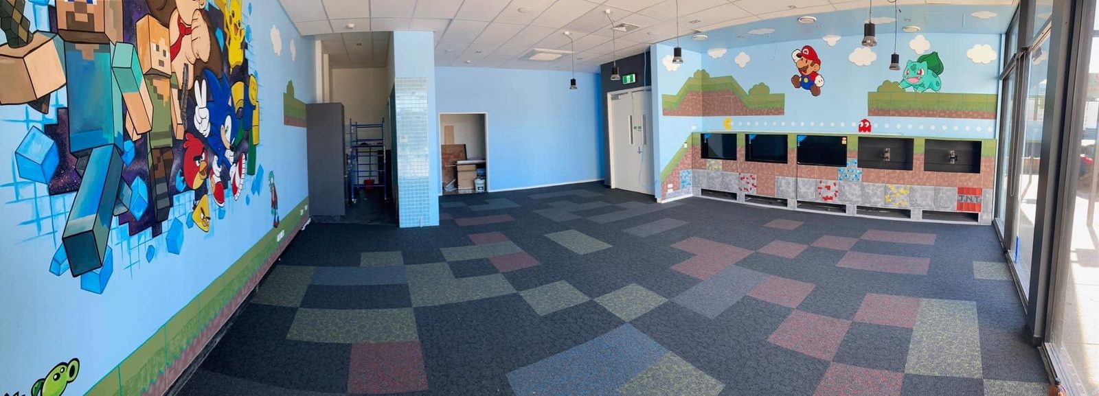 Pixel Party — Ten Forward room viewed across the carpeted floor towards the character mural