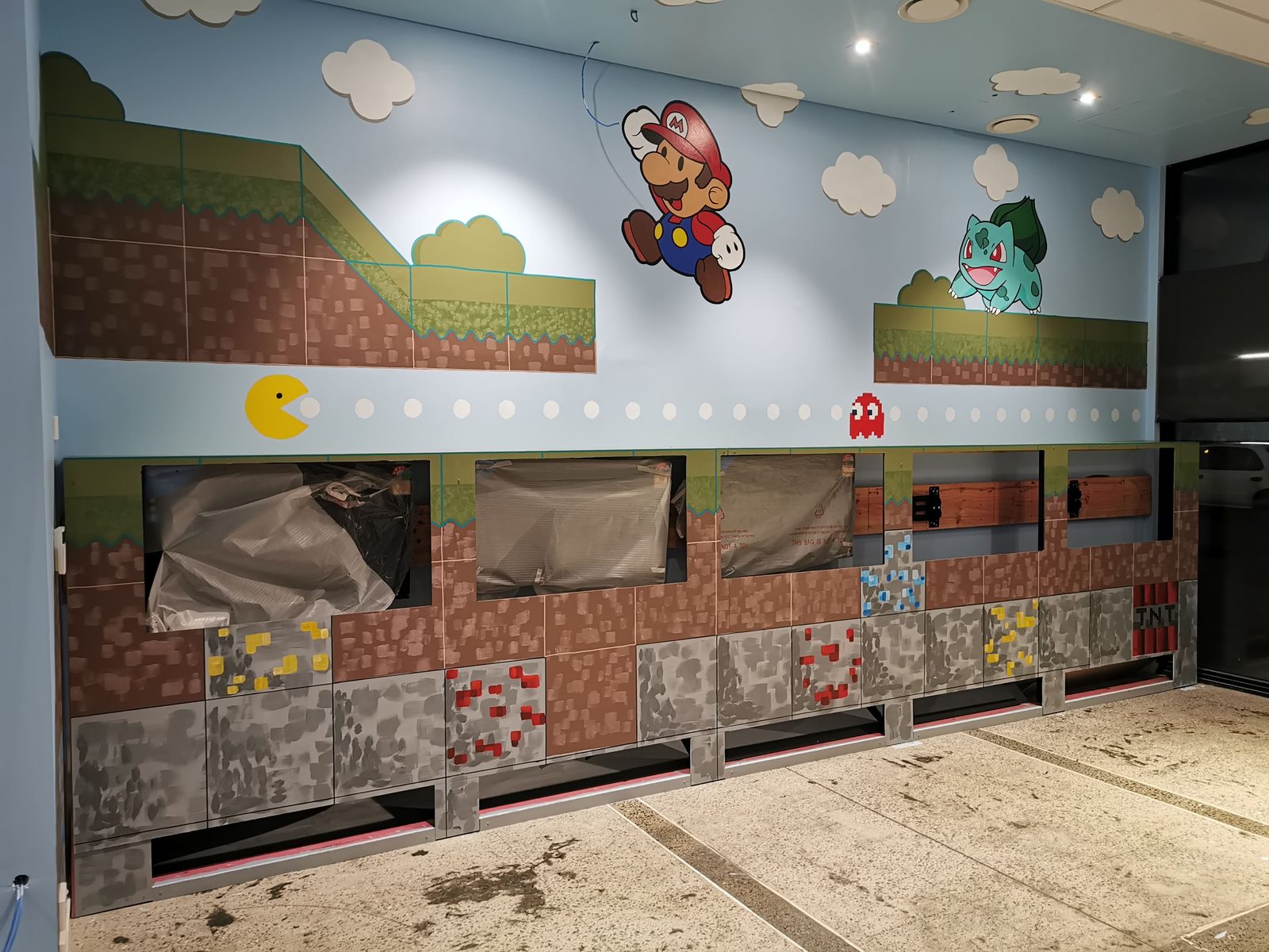 Pixel Party mural — finished Minecraft-themed feature wall with pixel-block landscape