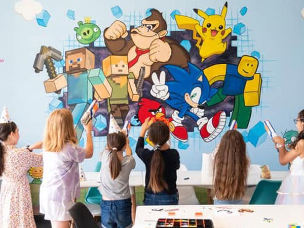 Pixel Party mural — Minecraft, Donkey Kong, Pikachu and Sonic characters on a pixel-block background at Ten Forward
