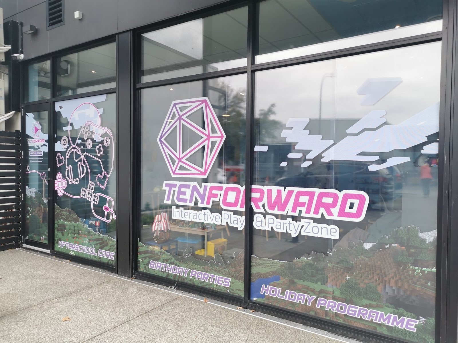 Ten Forward shopfront window with logo decal