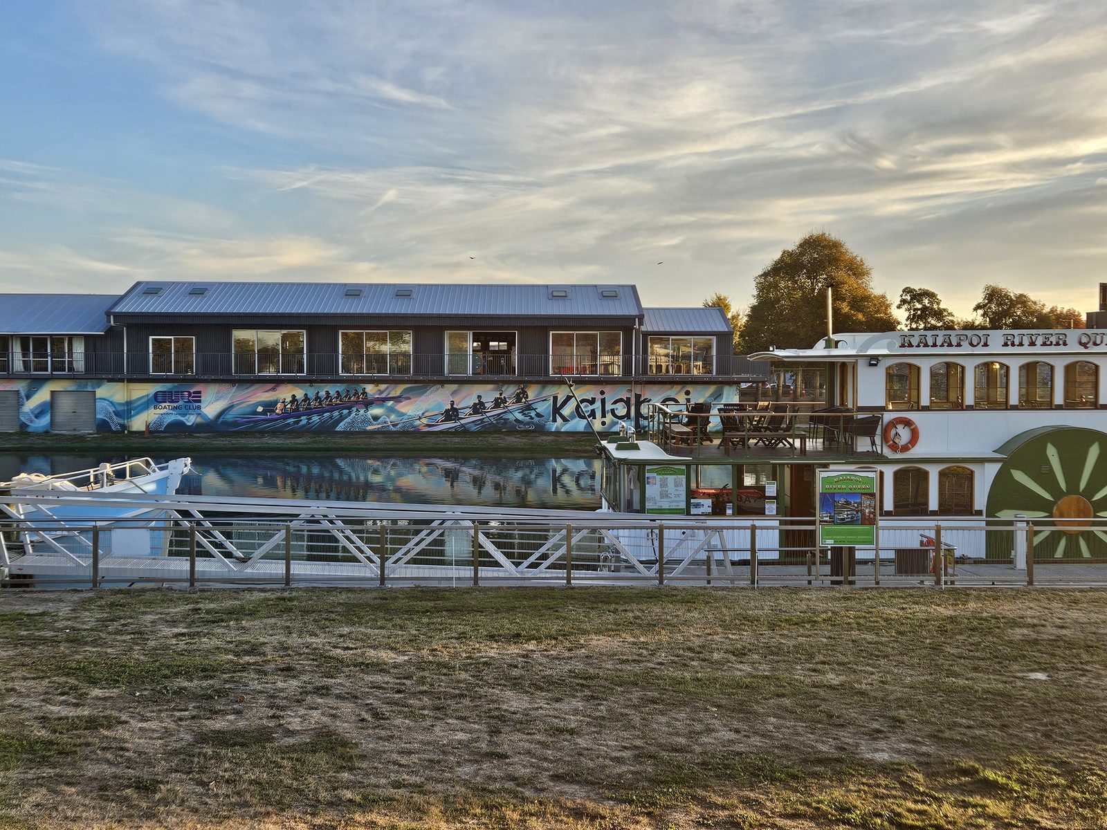 Pulling Together mural — wide daytime view of the finished building