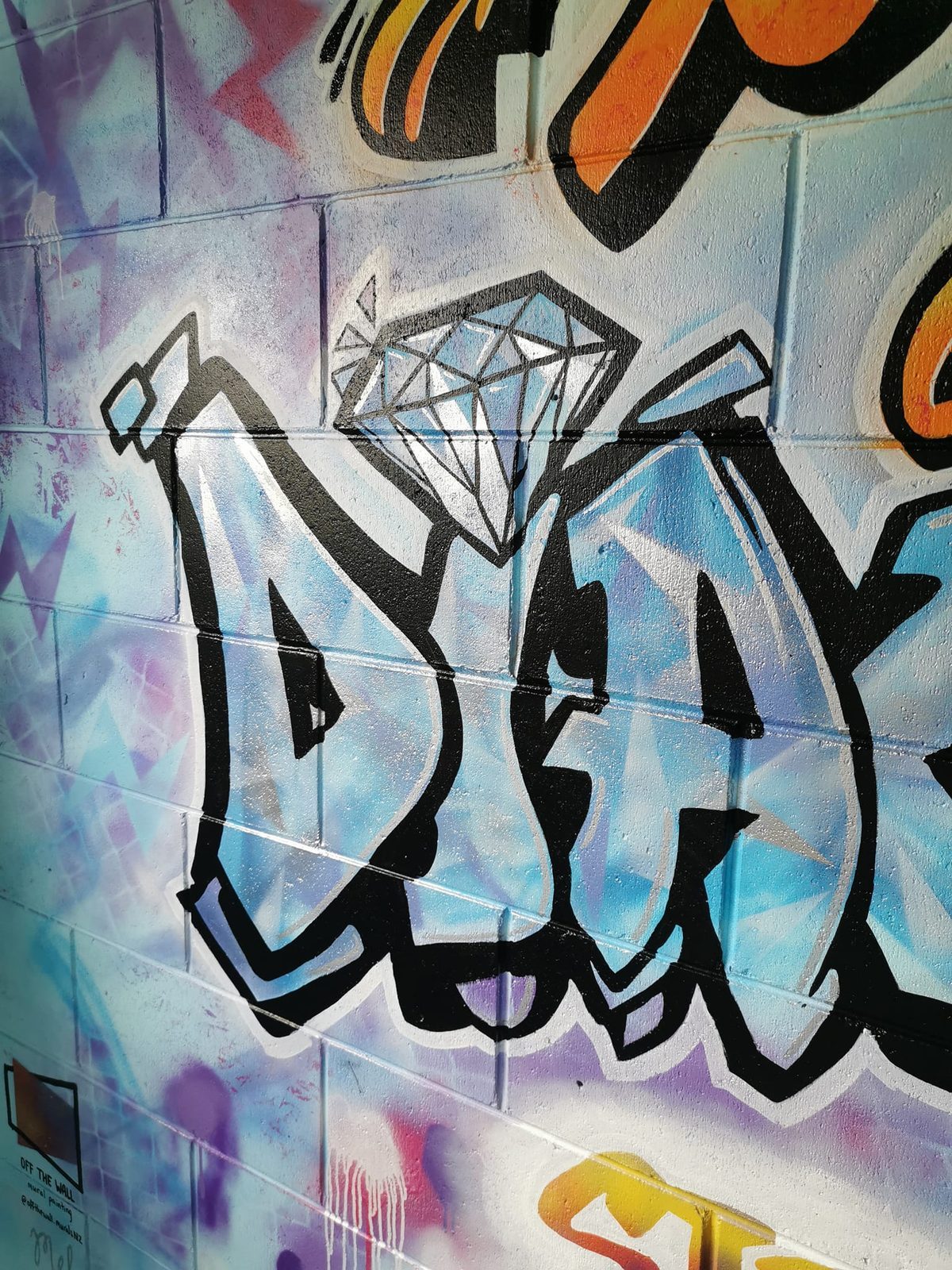 You Rock mural detail — close-up of the 'Diamonds' graffiti lettering