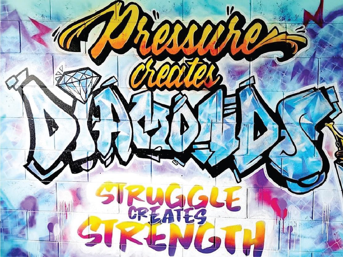 You Rock mural — full view of the 'Pressure creates diamonds, struggle creates strength' design