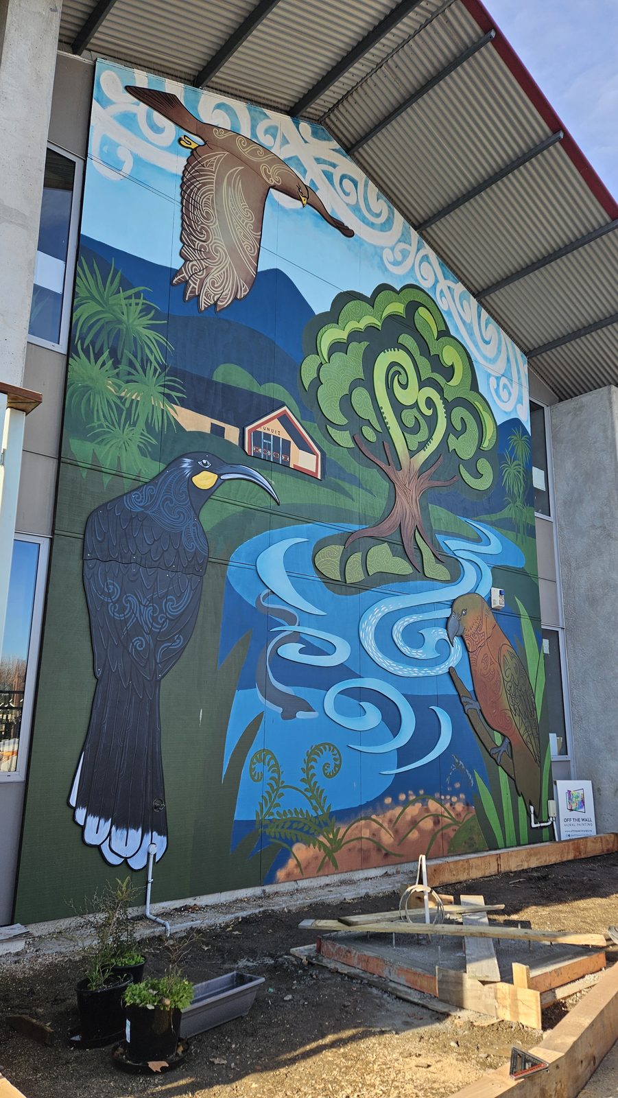 Around The Tree mural — full view of the finished tree, river and native birds