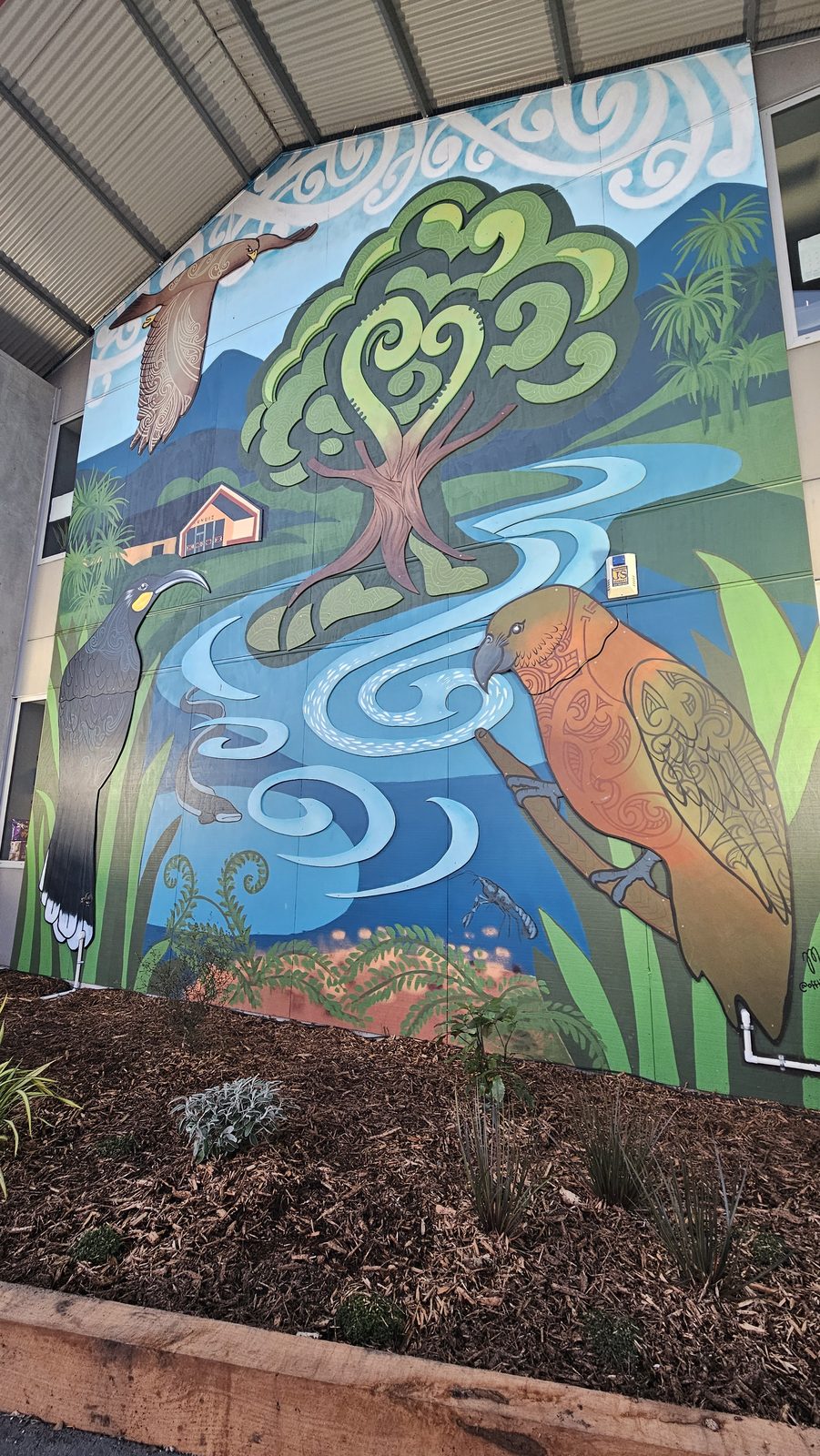 Around The Tree mural — finished tree and swirling river design with native birds