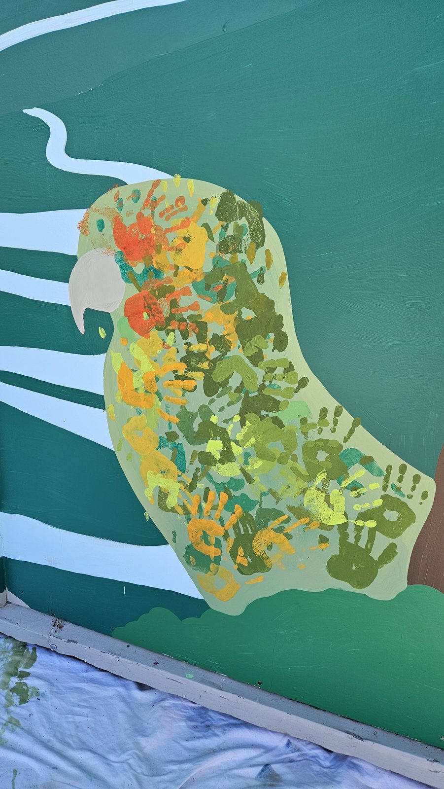 Flock Together mural in progress — close-up of a kākā shape filled with intricate pattern