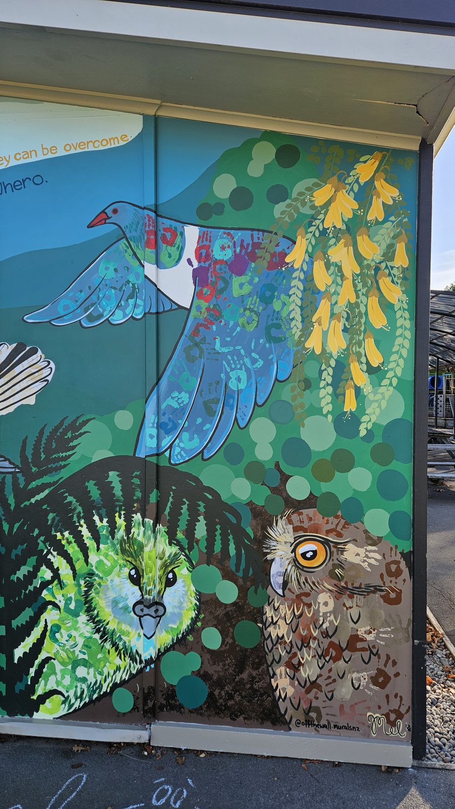 Flock Together mural detail — native birds and ferns at one end of the finished design