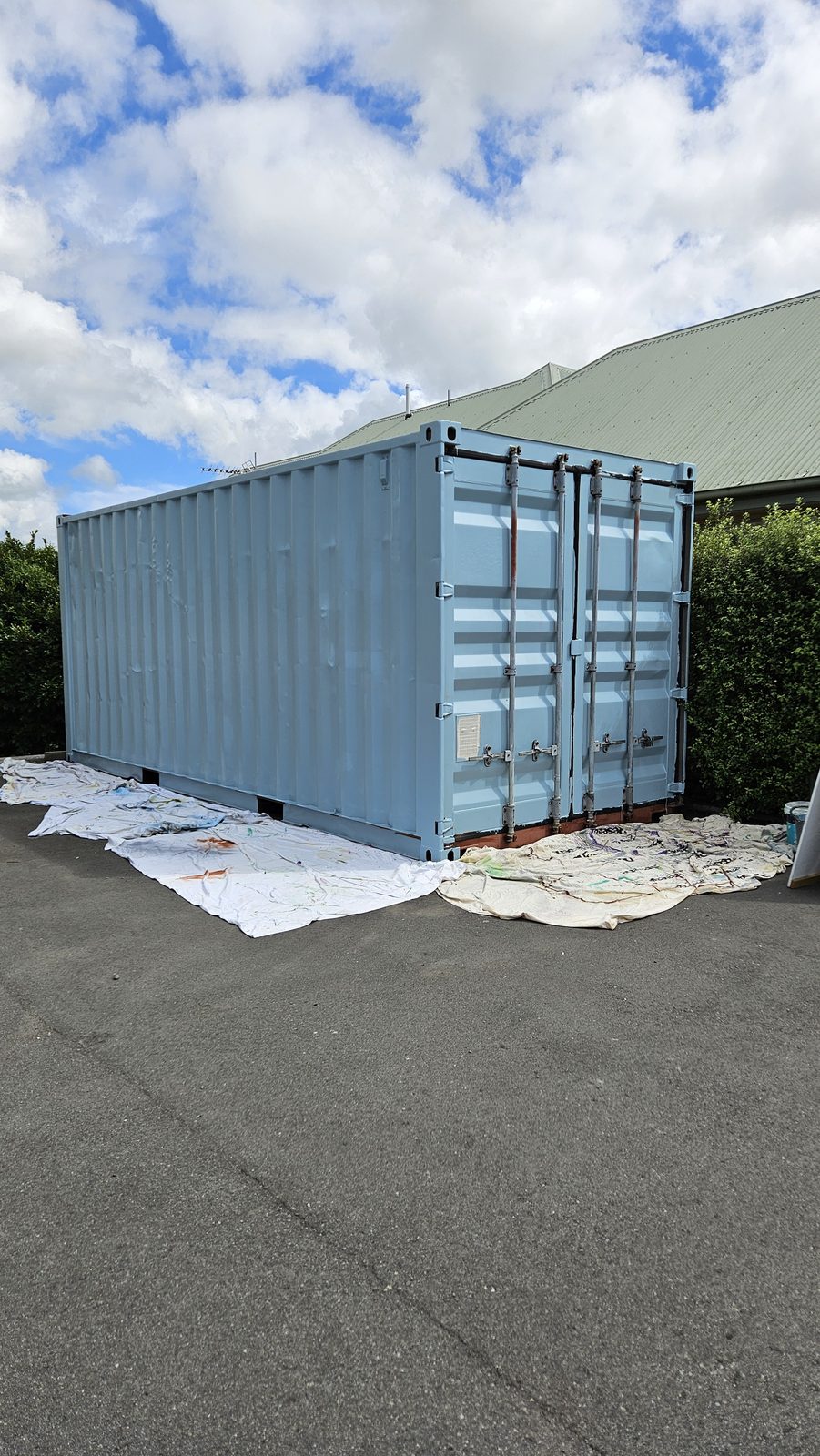 Growing Together — container primed pale blue ahead of painting