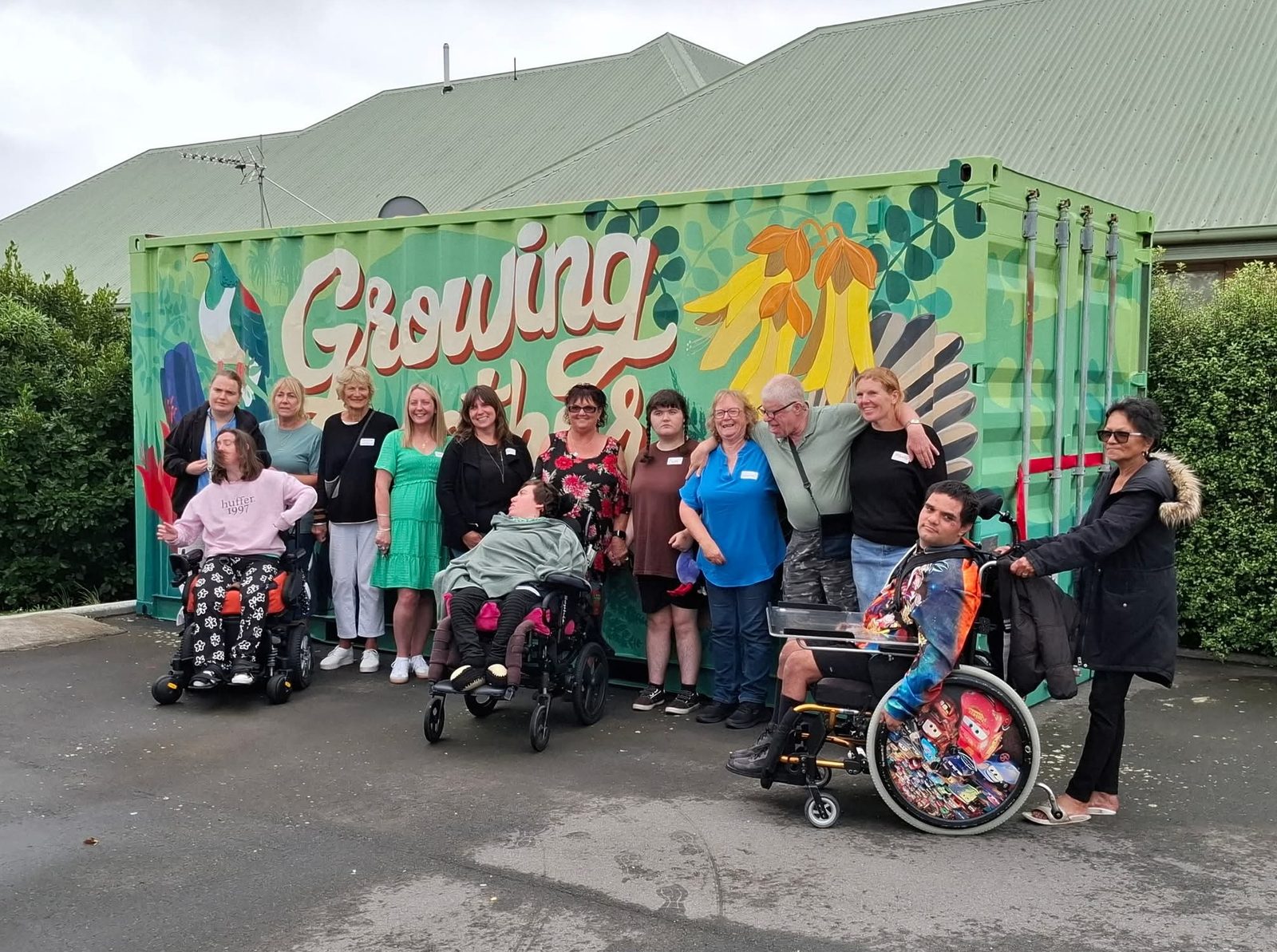 Growing Together mural — Chris Ruth Centre residents and staff gathered for a group photo in front of the finished mural