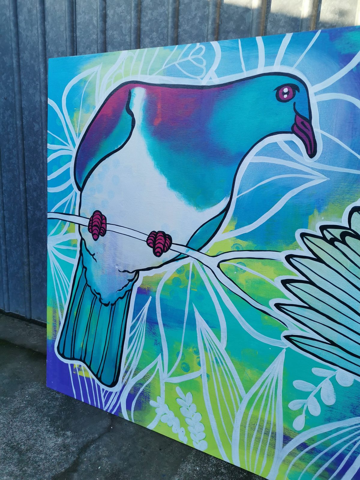Natures Playground mural detail — a kererū painted among ferns and leaves