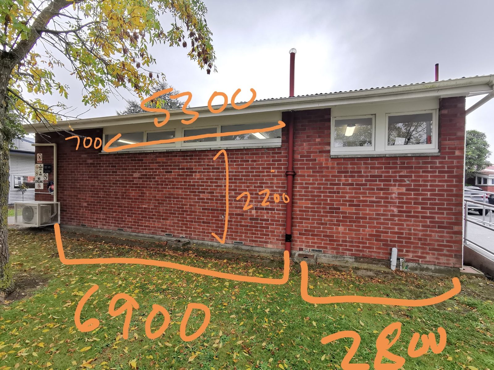 Our Stars — brick wall marked with layout measurements ahead of painting