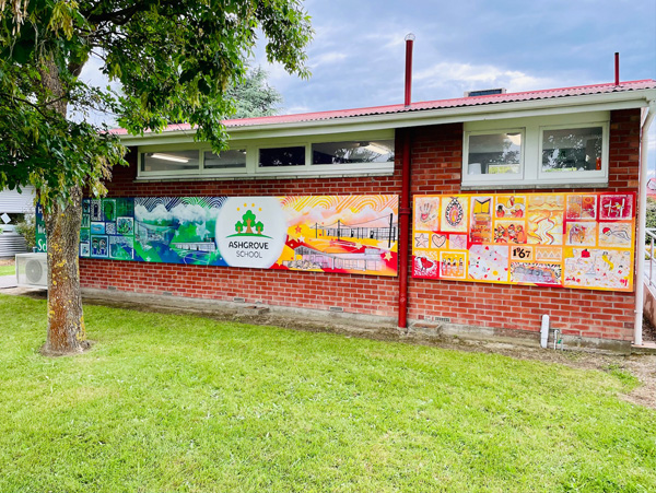 Our Stars mural — Tūtira Ashgrove School's mural wall featuring the school logo and a gallery of small student-painted panels