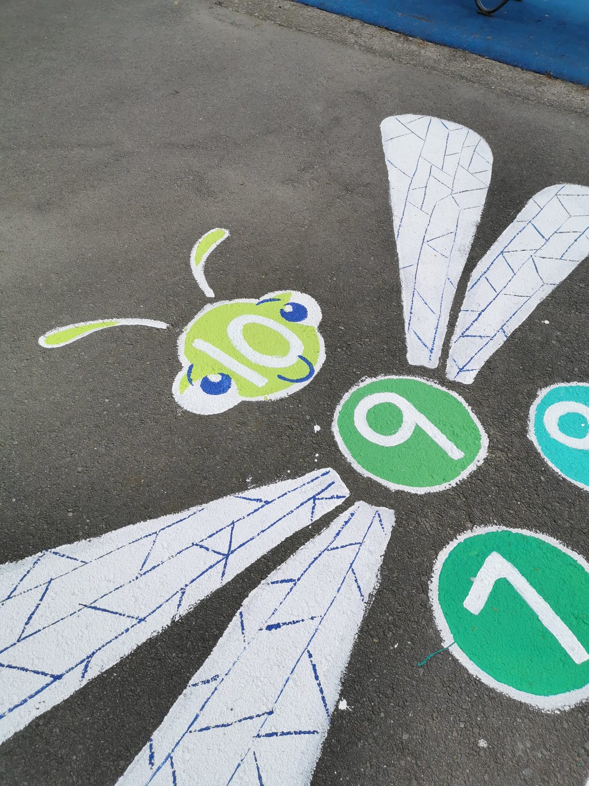 Playtime Bugs — a numbered hopscotch dragonfly game on the playground