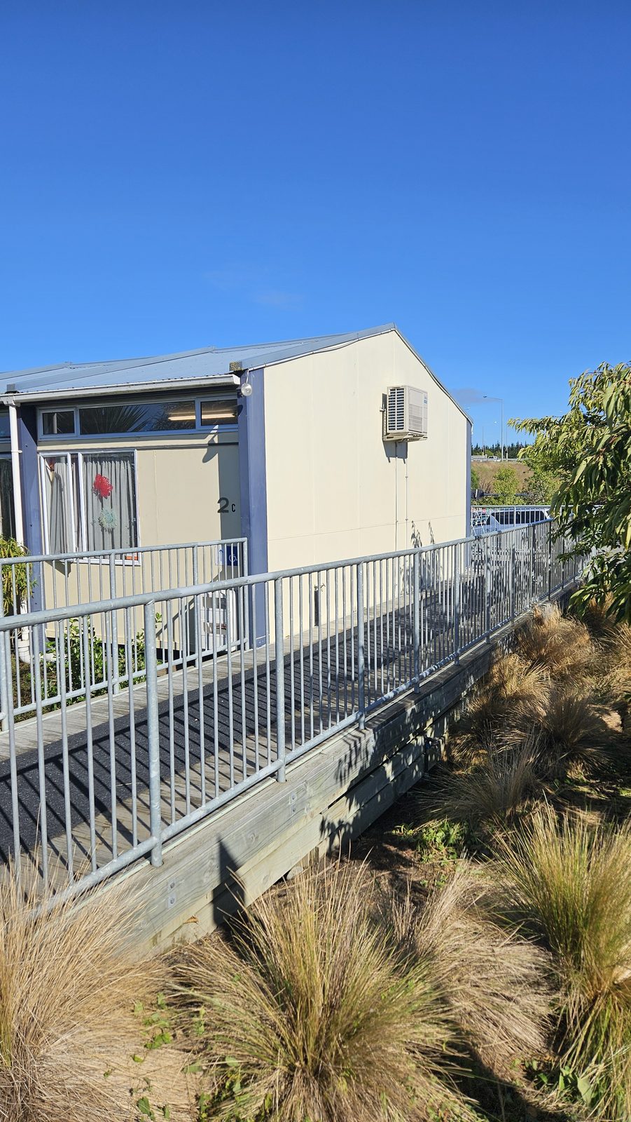 Turangawaewae — Chris Ruth Centre building before the mural, beside the footbridge