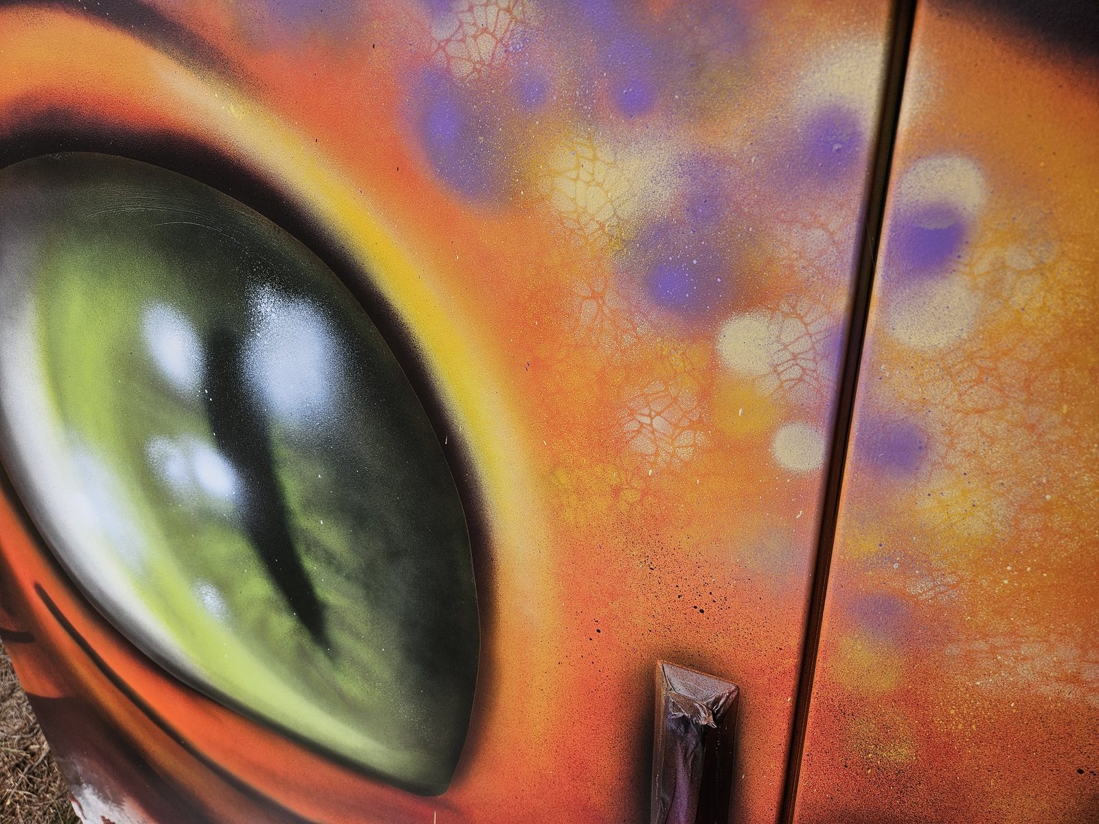 Hidden Treasure mural detail — close-up of the dragon's eye