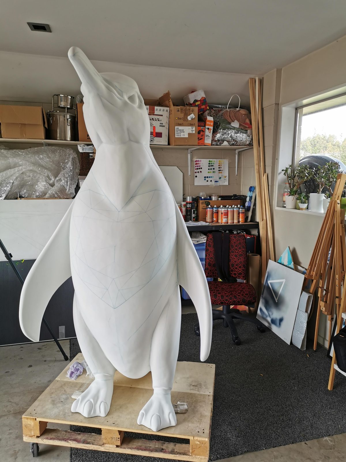 Ice sculpture — blank penguin sculpture in the workshop before painting