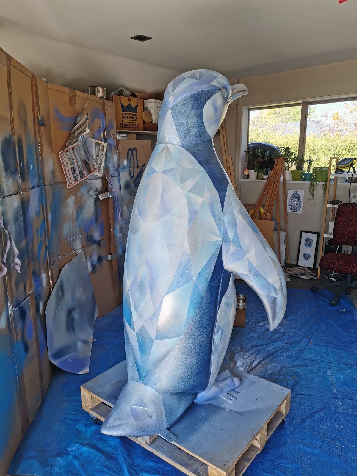 Ice sculpture in progress — most of the faceted blue pattern completed in the workshop
