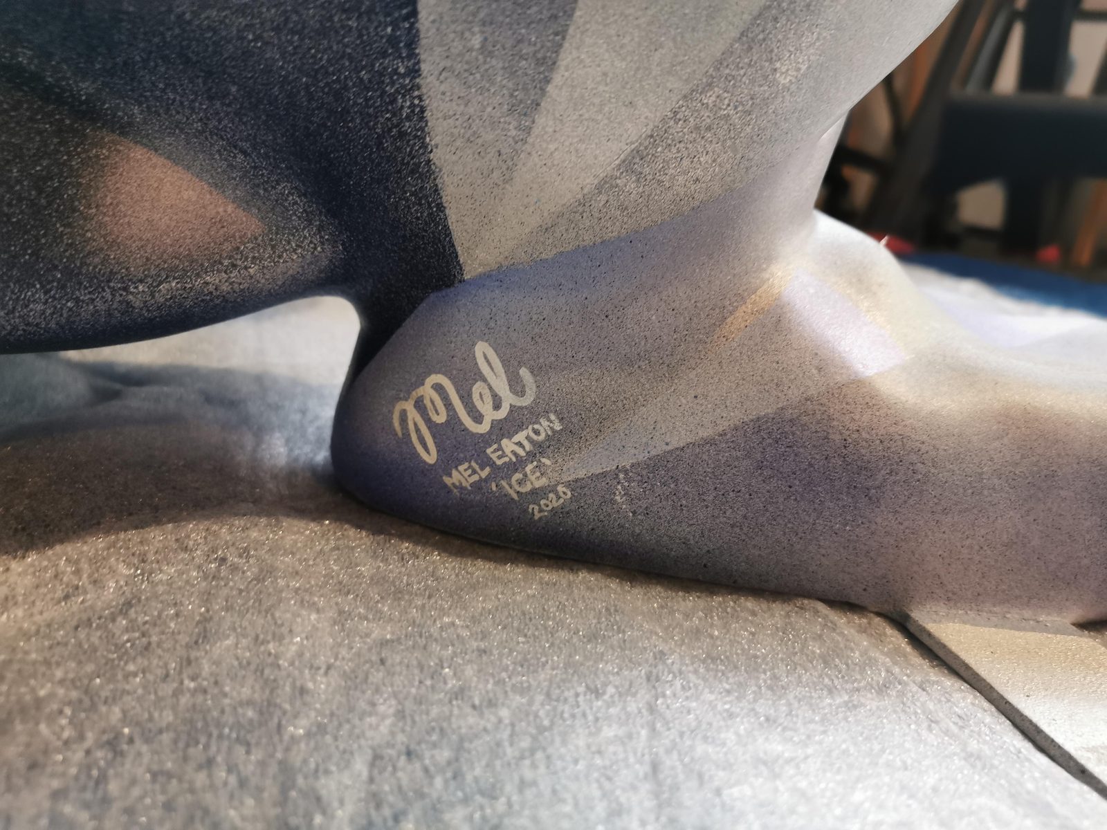 Ice sculpture detail — close-up of the faceted blue paintwork with Mel's signature