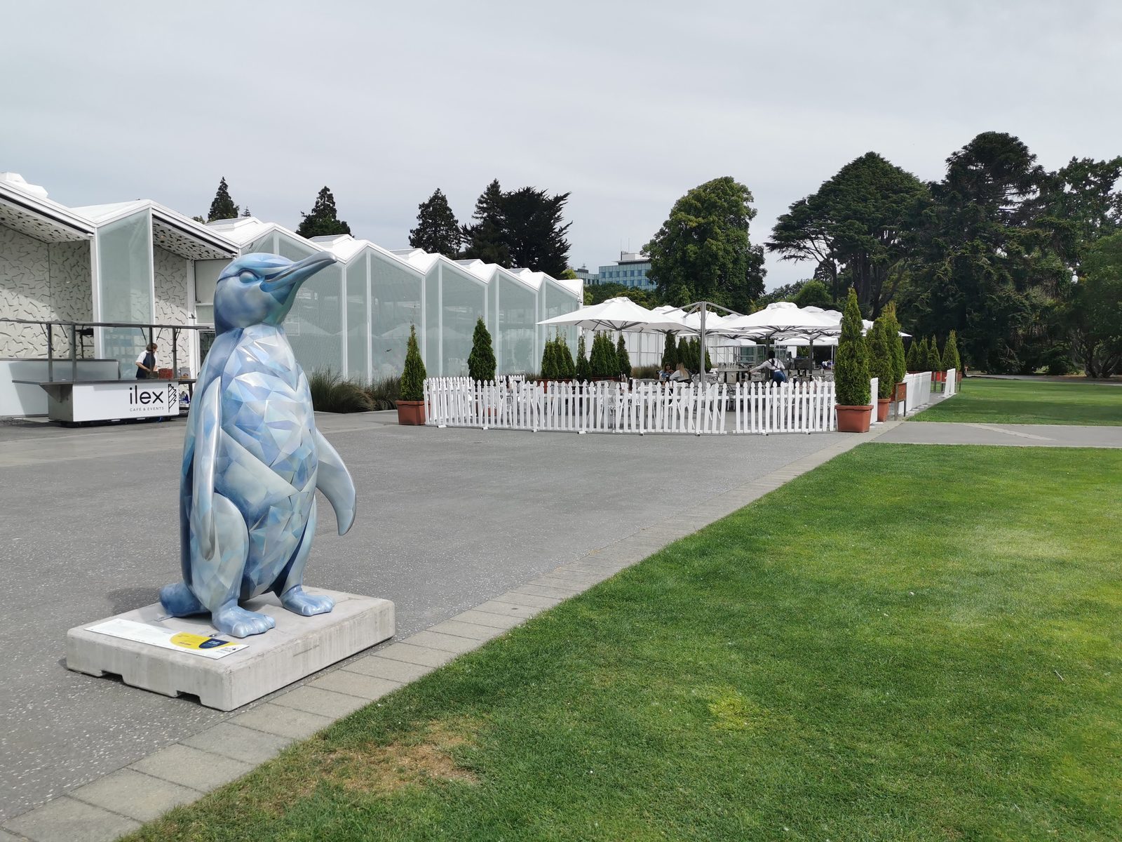 Ice sculpture — finished penguin on display outdoors near event marquees