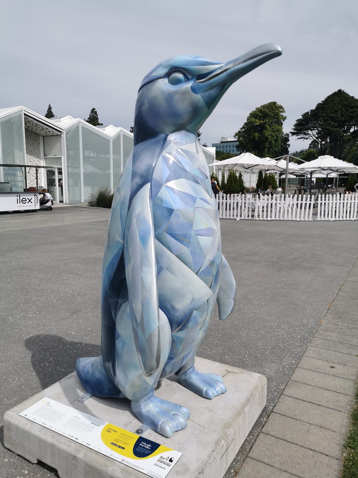 Ice sculpture — side view of the finished faceted penguin sculpture outdoors
