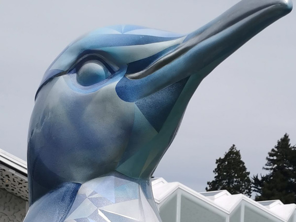 Ice sculpture — penguin sculpture painted with faceted, diamond-like blue and silver facets, Wild In Art Pop-up Penguins trail