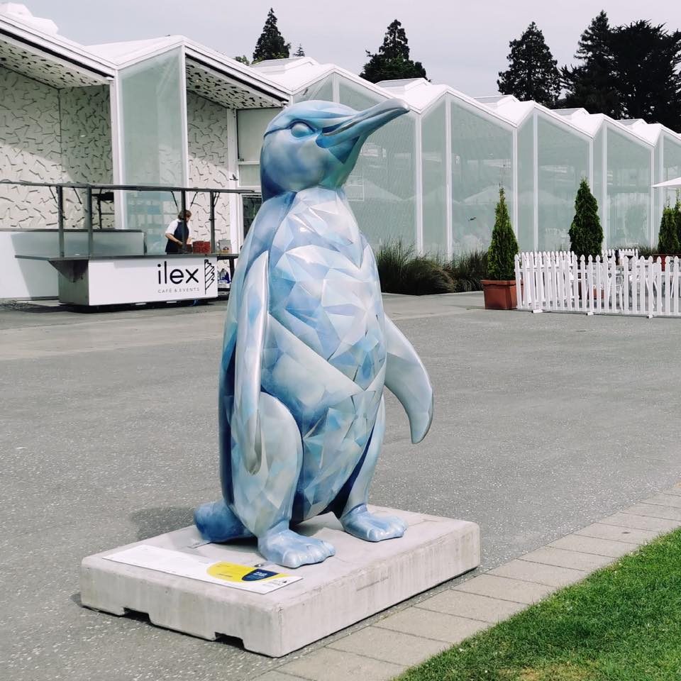 Ice sculpture — finished penguin sculpture on display in a car park setting