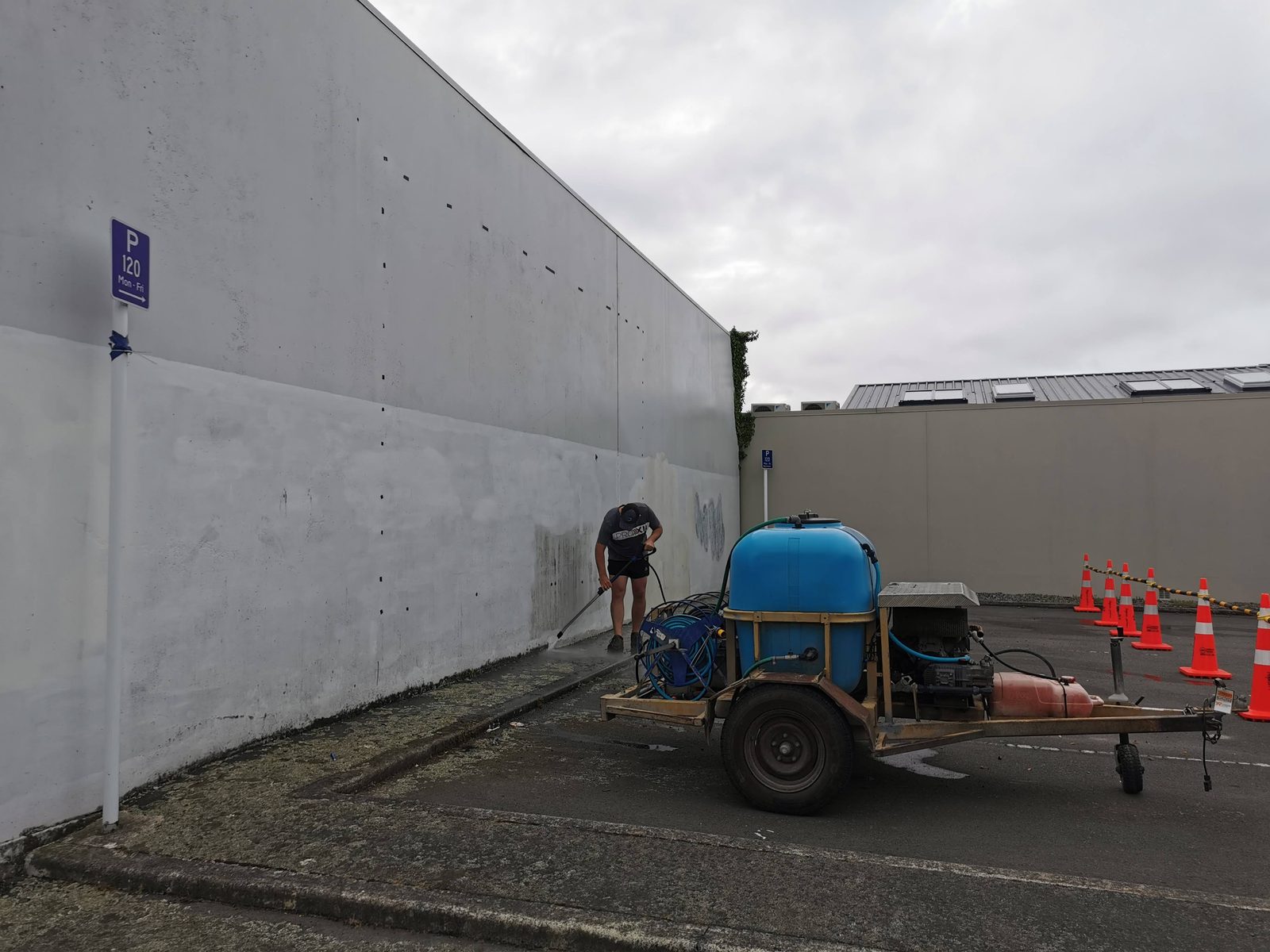 In Our Hands — Blake Street carpark wall before the mural, with site equipment in front