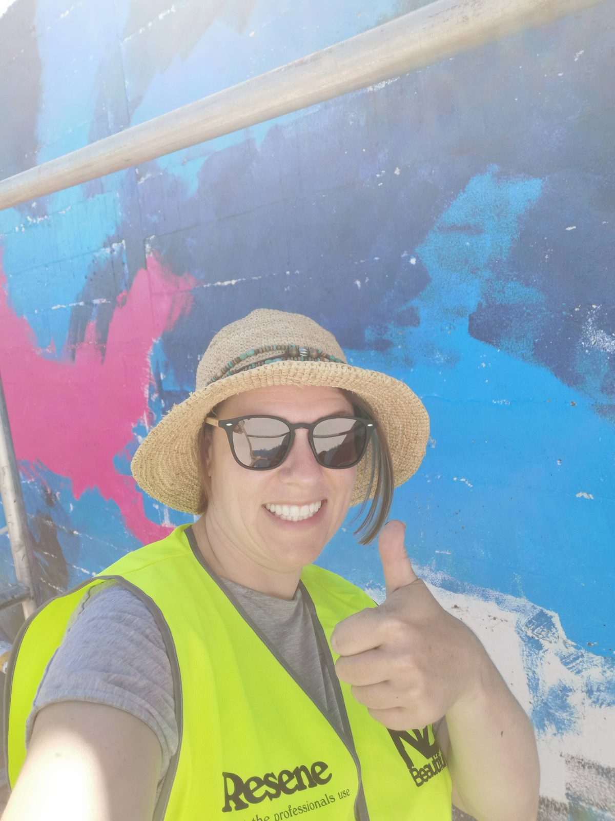 In Our Hands — Mel at the carpark site in a hi-vis vest before painting began