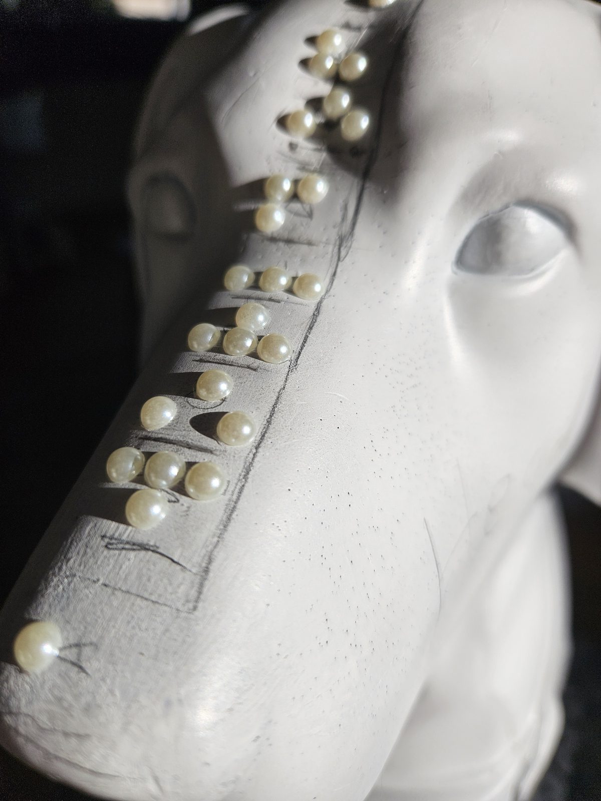 Louis Braille sculpture detail — close-up of the raised braille dots on the blank sculpture's snout