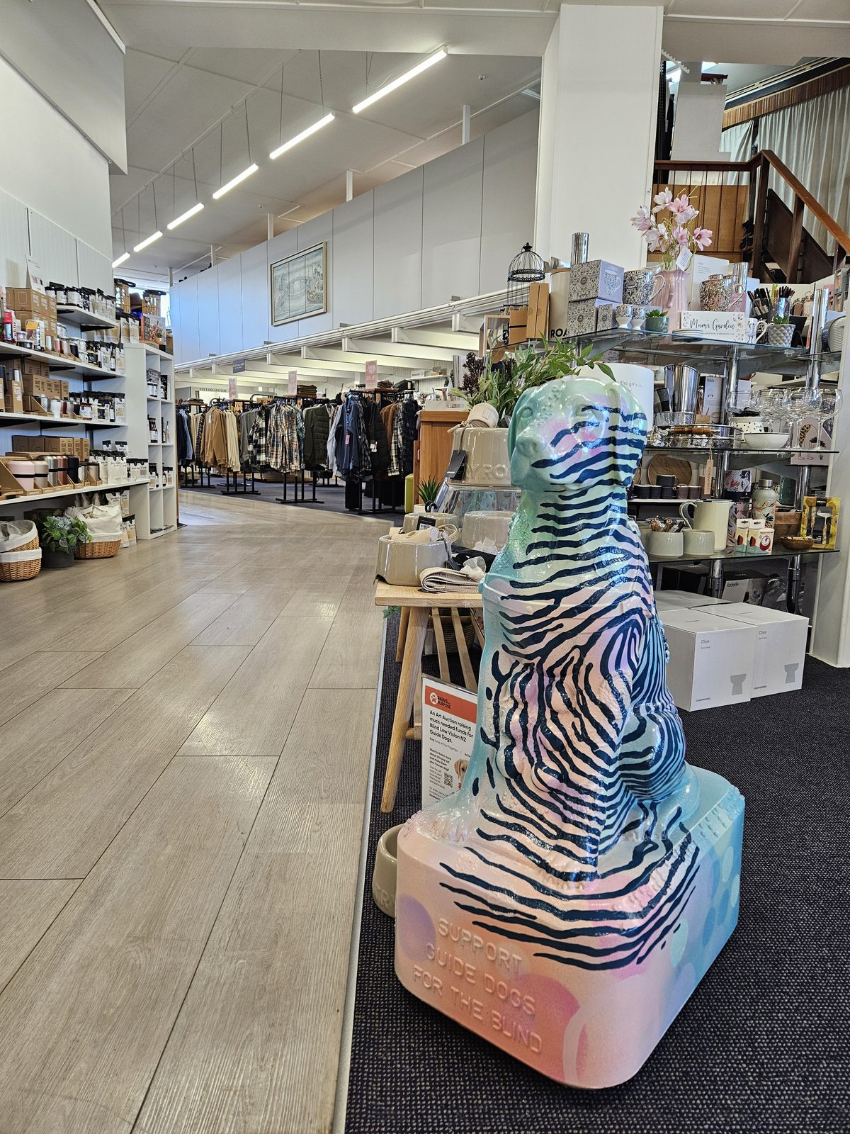 Louis Braille sculpture on display inside a retail store