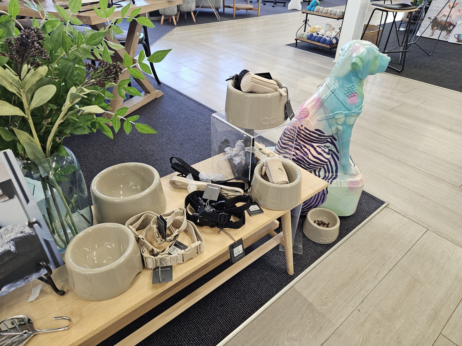 Louis Braille sculpture on display near plants and homeware inside the store