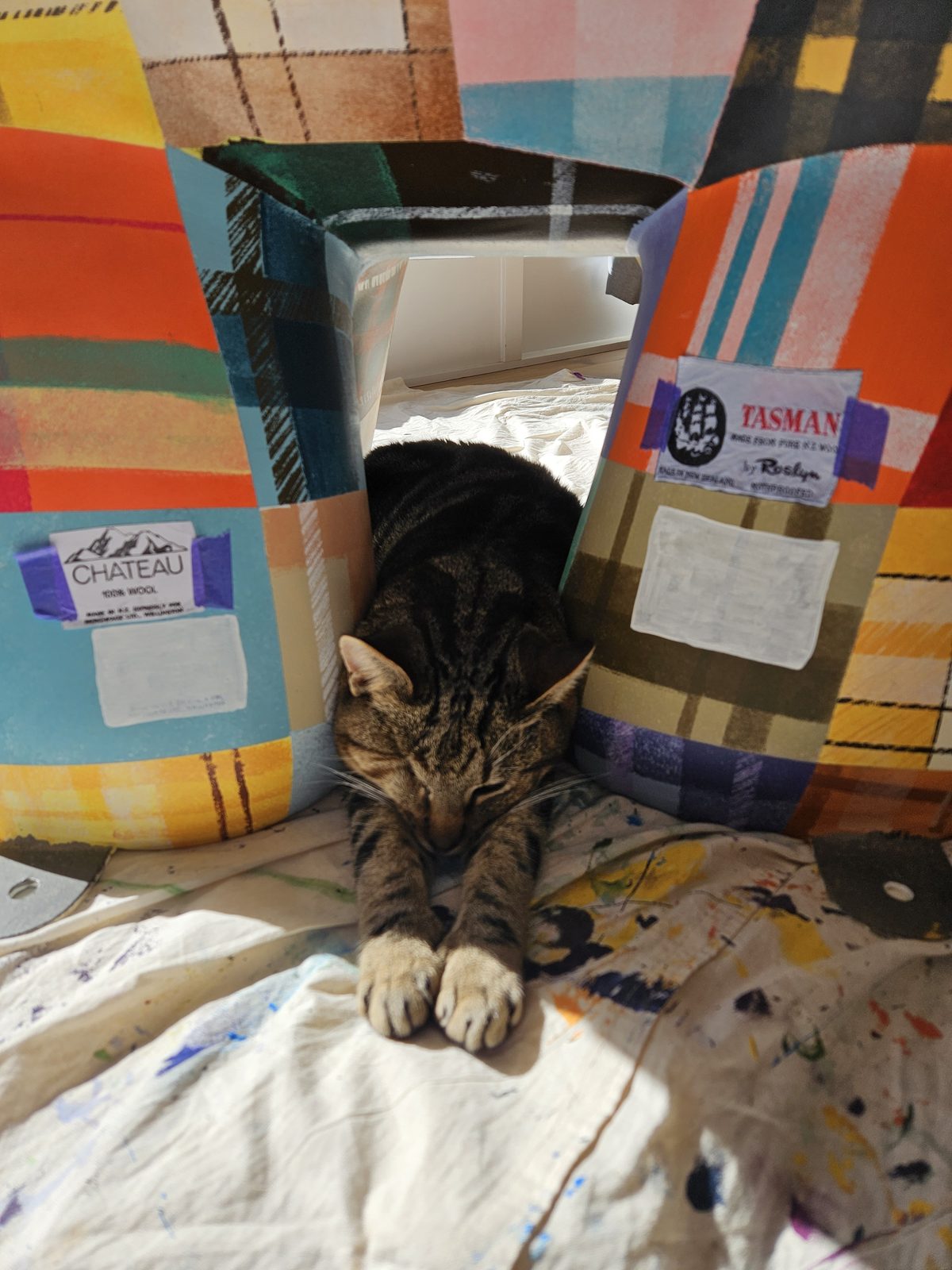 Mammoth Wolley mural in progress — colourful patchwork being painted onto the elephant sculpture