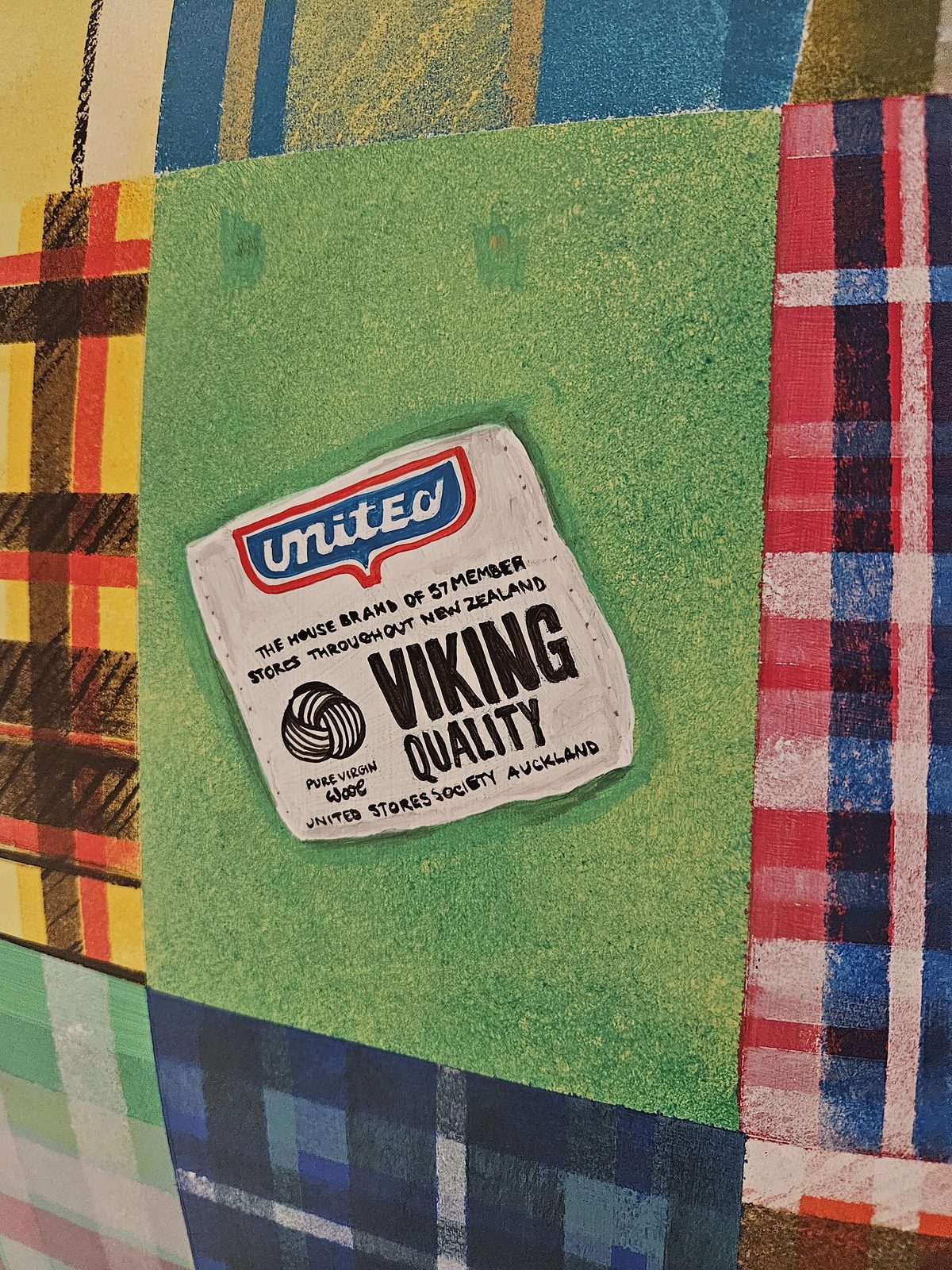 Mammoth Wolley sculpture detail — close-up of another wool mill label on the patchwork