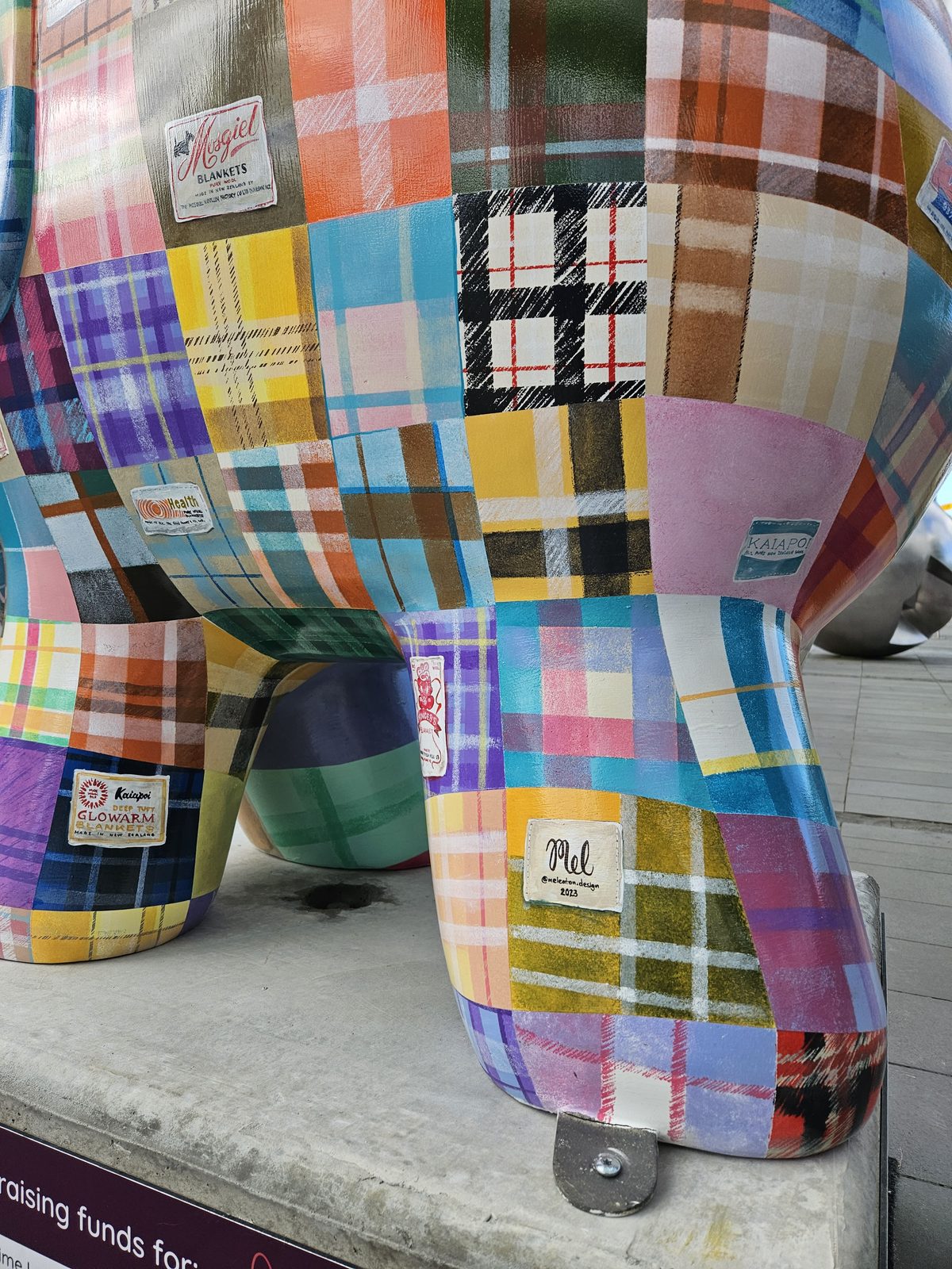 Mammoth Wolley sculpture — close side view of the finished patchwork design outdoors