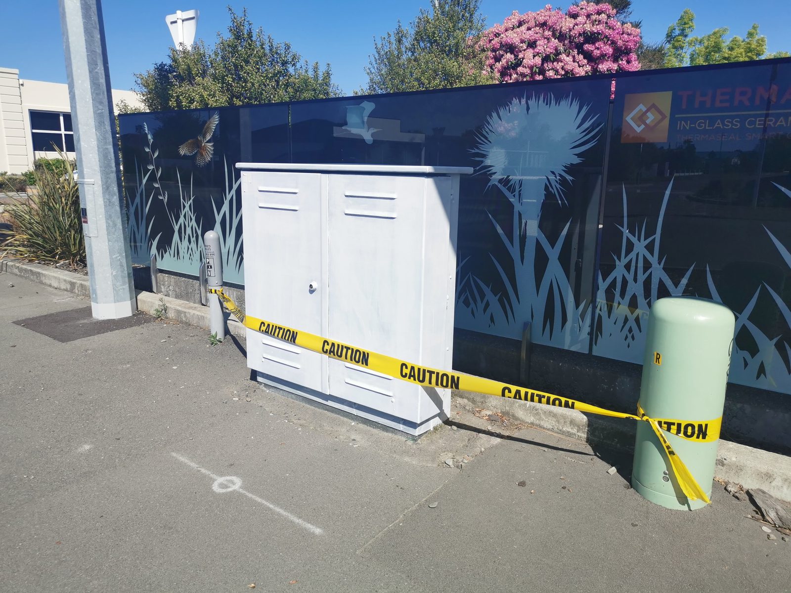 Tui Song — cabinet taped up ready for painting beside the decal wall