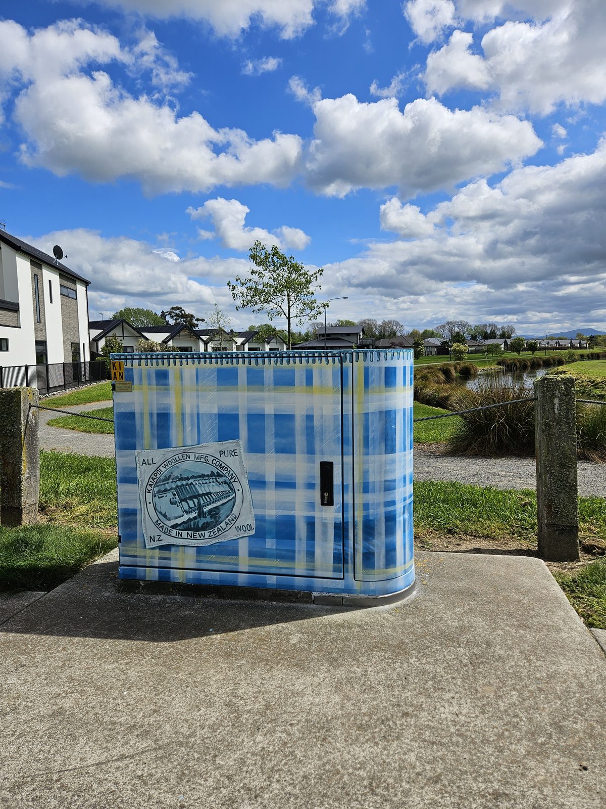 Woven History mural — wide view of the cabinet in its residential setting