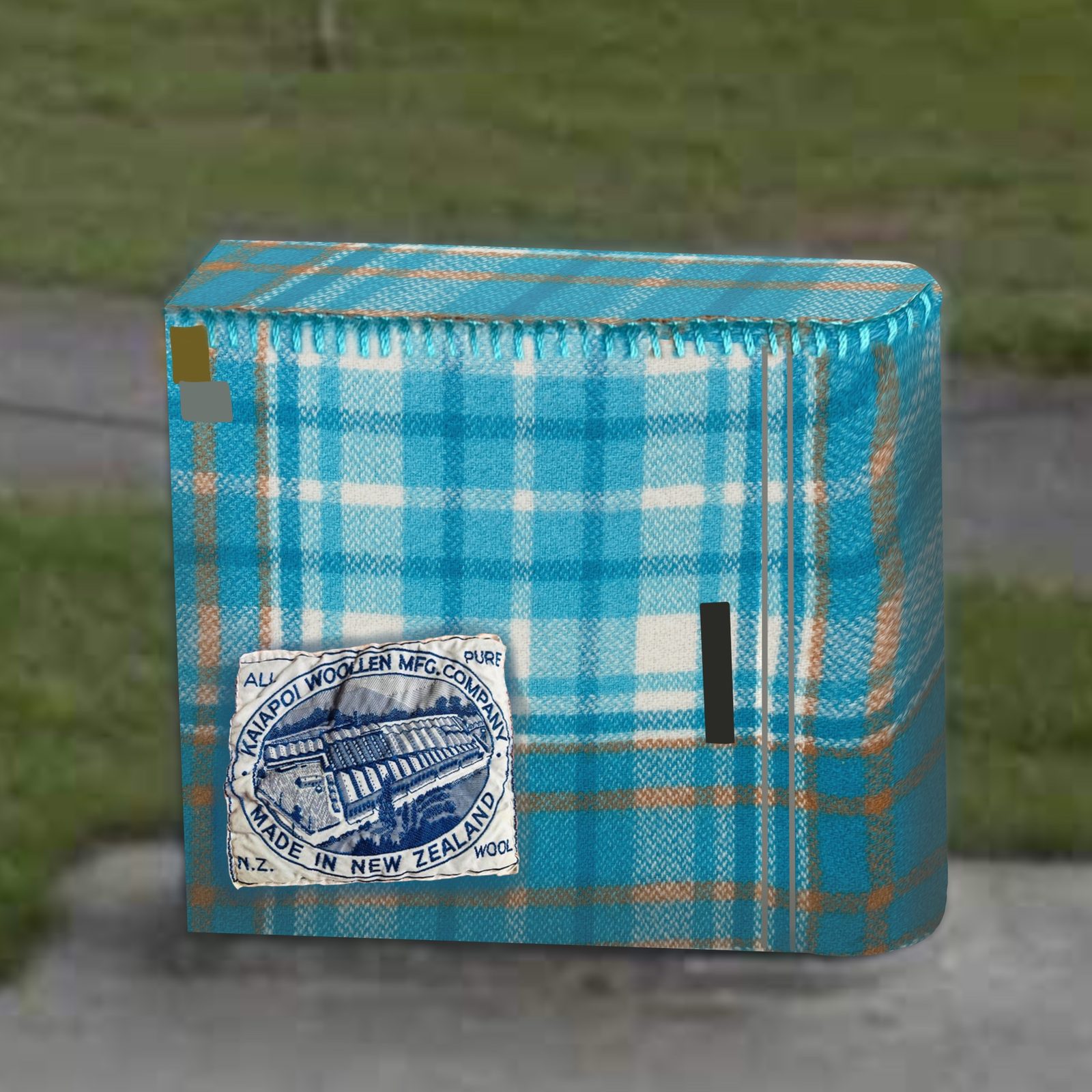 Woven History mural — finished teal and blue tartan plaid design with the wool mill label