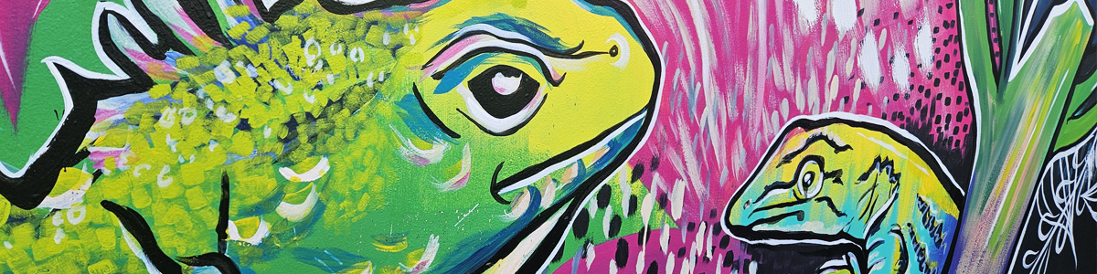 Off The Wall public art mural work — close-up of a bright green and yellow gecko design against a pink spotted background